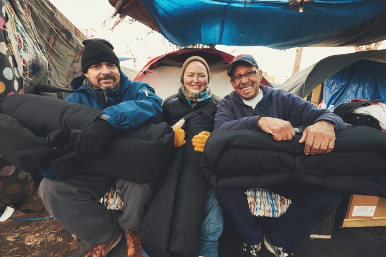 Empowering change: Lucky Duck Foundation provides essential support to the homeless community in San Diego. Image shows individuals receiving sleeping bags as part of the foundation's efforts to alleviate homelessness.